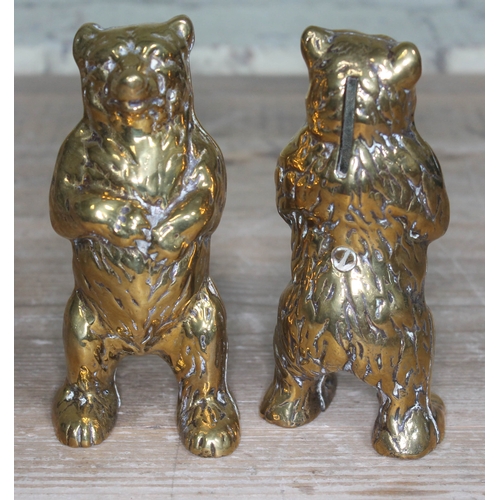 282 - A pair of cast brass monkey boxes formed as bears standing on hind legs, height 15cm.