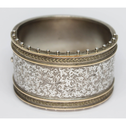 173 - A Victorian bright cut engraved bangle, diam. approx. 5.5cm, unmarked, wt. 2oz.