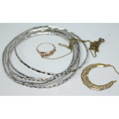 240 - A mixed lot comprising a set of white metal bangles, a ring marked '9ct', an earring rings marked '3... 