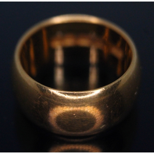 243 - A hallmarked 22ct gold wedding band, wt. 11.69g, size K.