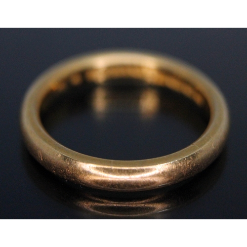 245 - A hallmarked 22ct gold wedding band, wt. 5.63g, size M.