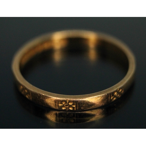 247 - A hallmarked 22ct gold wedding band with outer engraved designs, wt. 2.28g, size N.