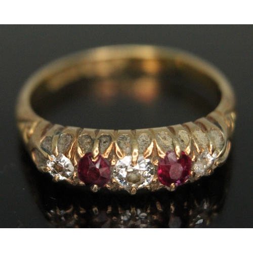 258 - A diamond and ruby ring, band marked '18ct', gross wt. 4.18g, size P.