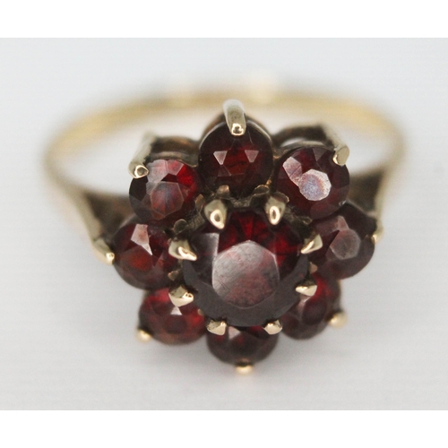 266 - A hallmarked 9ct gold garnet cluster ring, the cluster head approx. 11mm x 11mm, gross wt. 2.74g, si... 