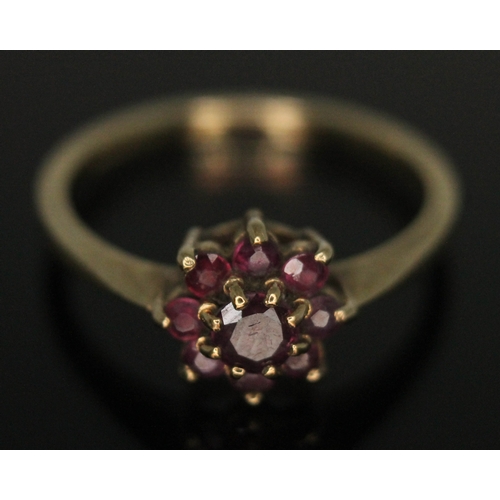 269 - A hallmarked 9ct gold ruby cluster ring, head diam. approx. 7mm, gross wt. 1.93g, size N.