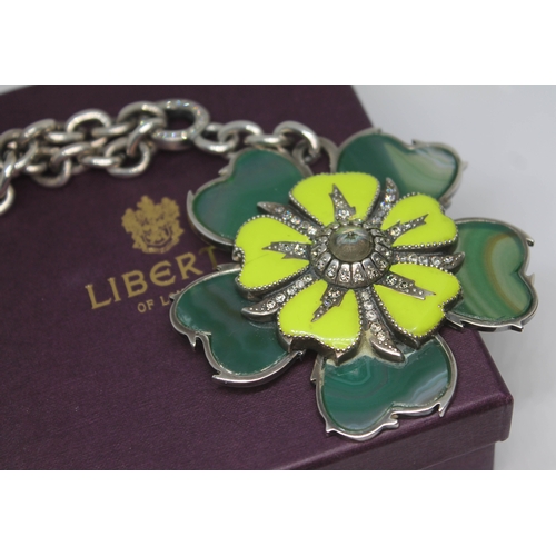 276 - A contemporary flower pendant with green dyed agate petals, yellow enamel and set with paste, suspen... 