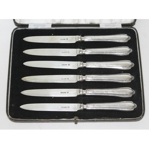 322 - A cased set of six hallmarked silver handled and bladed knives.