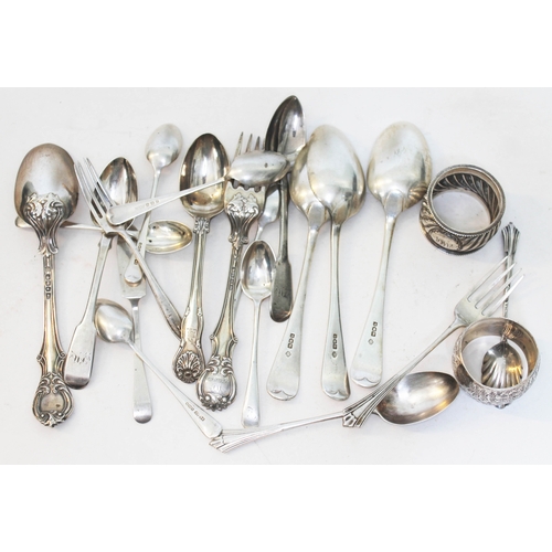 334 - A mixed lot of hallmarked silver comprising two serviette rings, spoons and forks, various dates and... 