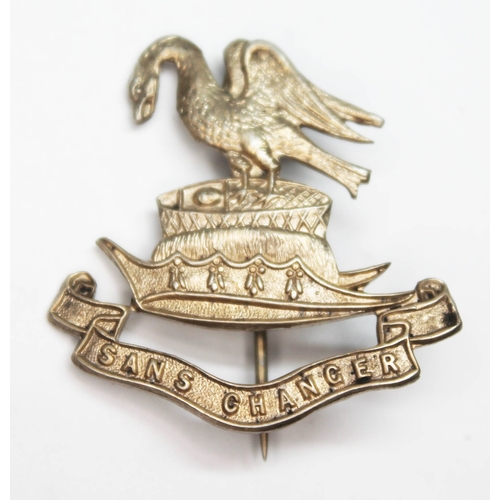 335 - A Liverpool pals regimental cap badge, marked 'Sterling', maker's initials 'TLM'.