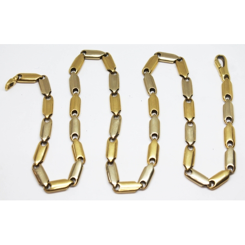 337 - An Italian two colour smooth link chain, length 71cm, marked '18KT', wt. 41.44g.