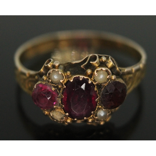 365 - A George III 15ct gold ring set with two purple almandine garnets and split pearls, hallmarked Birmi... 