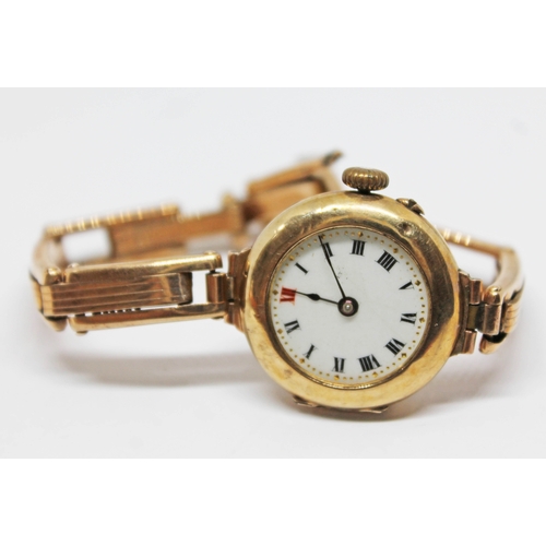 385 - A hallmarked 9ct gold ladies wristwatch with strap marked '9ct', gross wt. 20.59g.