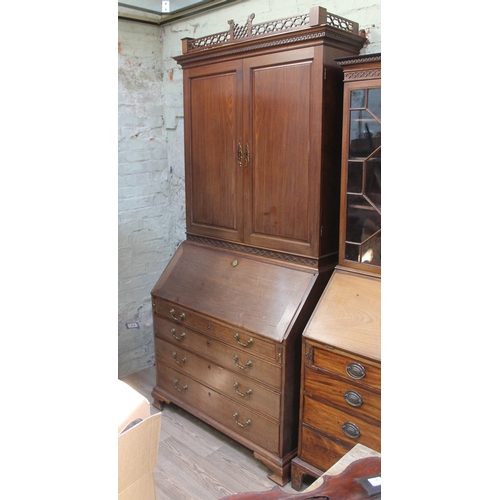 49 - A Georgian Chippendale style mahogany cabinet bureau, width 112cm, depth 63cm & height 236cm.