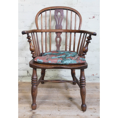 52 - A 19th century ash Windsor chair.