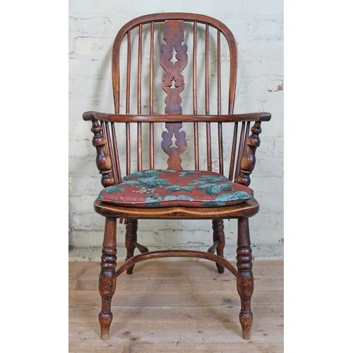 54 - A 19th century ash Windsor chair with crinoline stretcher.