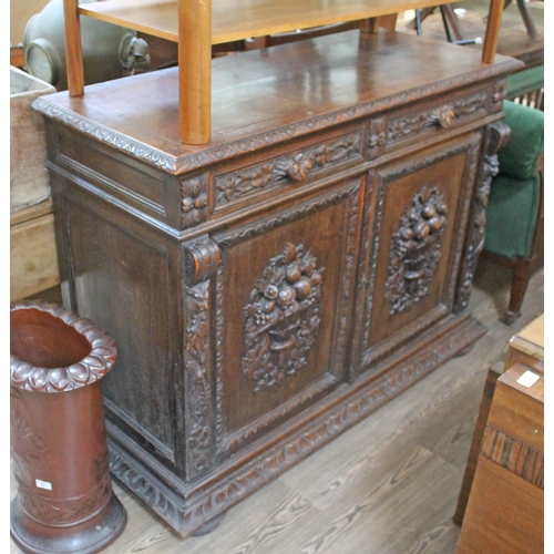 64 - A 19th century continental carved oak cabinet width 137cm, depth 54cm & height 101cm.
