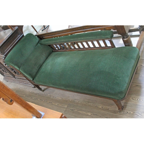 65 - An Edwardian oak chaise longue, length 183cm.
