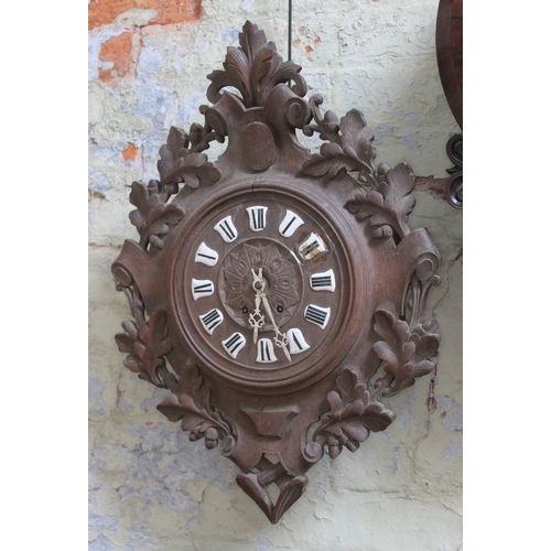 79 - A 19th century Black Forest wall clock with enamel Roman numerals, length 65cm.