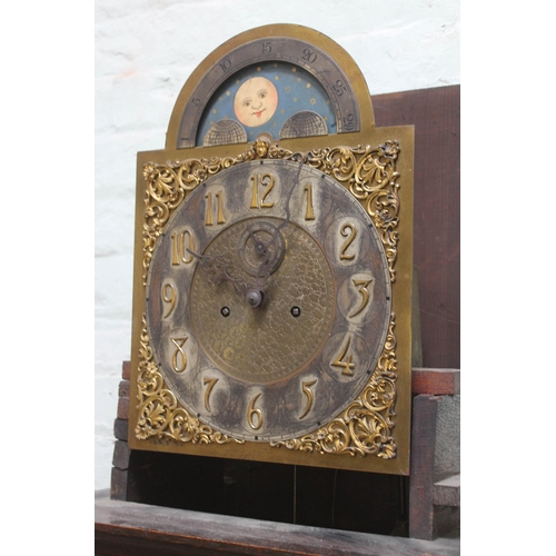 81 - A late Victorian oak long case clock with domed hood, brass and silvered dial with gothic numerals a... 