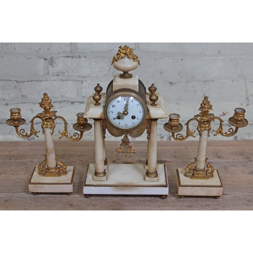 84 - A French ormulu mounted marble clock garniture, clock height 42cm.