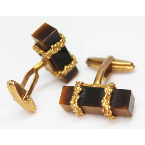 92 - A pair of hallmarked 9ct gold cufflinks set with rectangular prism cut quartz tiger's eye, length 22... 