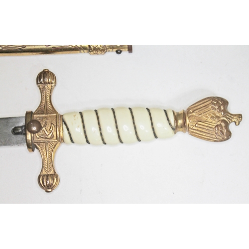 393 - A German WWII Third Reich Kriegsmarine dagger, wire bound plastic grip with gilt brass swastika and ... 