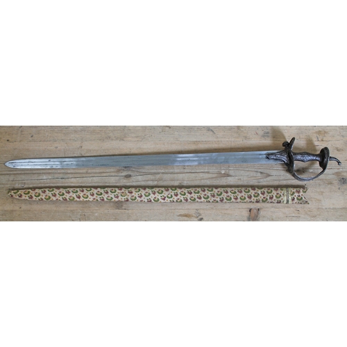 408 - An Indian 18th/19th century sword, open work guard, double fullered blade and cloth bound wooden sca... 