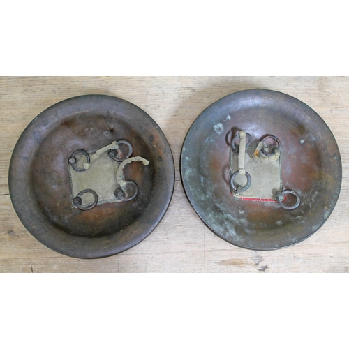 412 - A pair of Indian dhal shields, diam. 21.5cm.