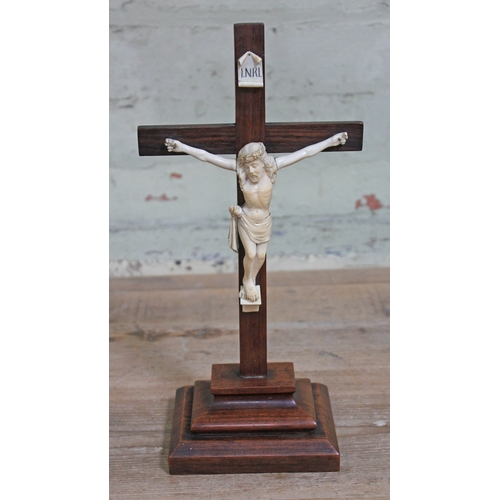 429 - A late 19th century rosewood crucifix with carved ivory figure of christ, height 34cm.