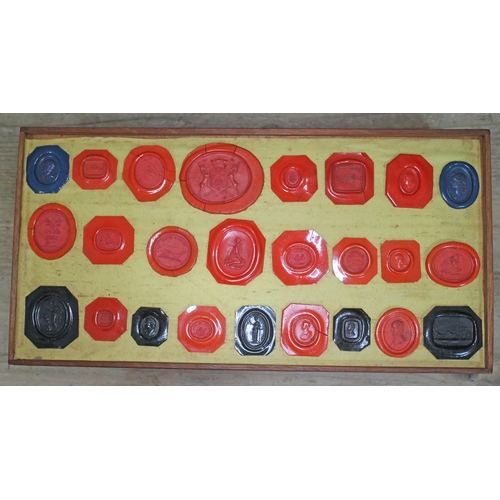 490 - A Georgian mahogany specimen box housing an extensive collection of wax intaglio seal impressions, e... 