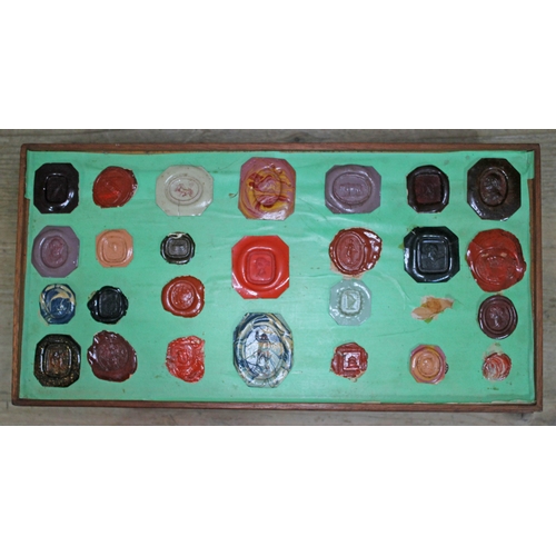 490 - A Georgian mahogany specimen box housing an extensive collection of wax intaglio seal impressions, e... 