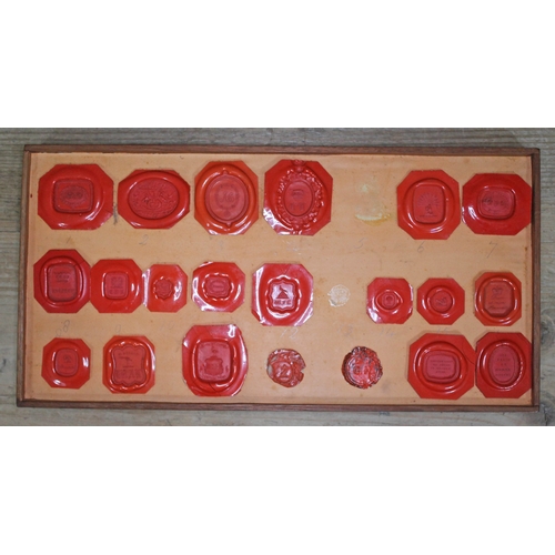 490 - A Georgian mahogany specimen box housing an extensive collection of wax intaglio seal impressions, e... 