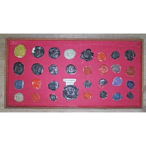 490 - A Georgian mahogany specimen box housing an extensive collection of wax intaglio seal impressions, e... 