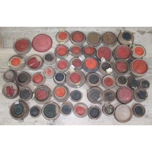 491 - A quantity of wax intaglio seal impressions, medieval 13th century and later, each contained in tree... 