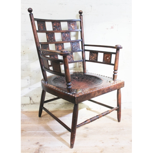 88F - A late Victorian Arts & Crafts armchair with embossed leather panels depicting various animals, embo... 
