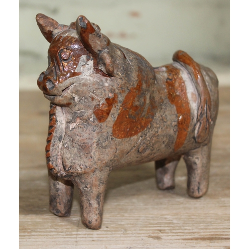 492 - A zoomorphic pottery terracotta cow figure in the Indus Valley style, length 14.5cm.