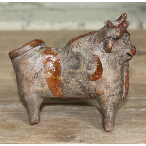 492 - A zoomorphic pottery terracotta cow figure in the Indus Valley style, length 14.5cm.