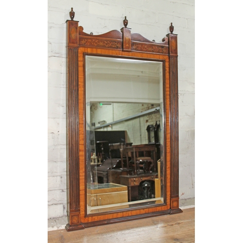 88G - A George III style mahogany mirror having turned urn finials, scrolls interspersed by neo classical ... 