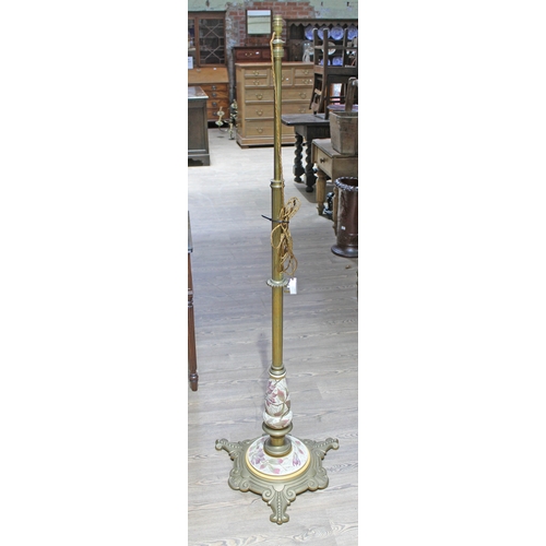 88H - A late 19th century adjustable brass column standard lamp with stoneware and weight cast brass base.