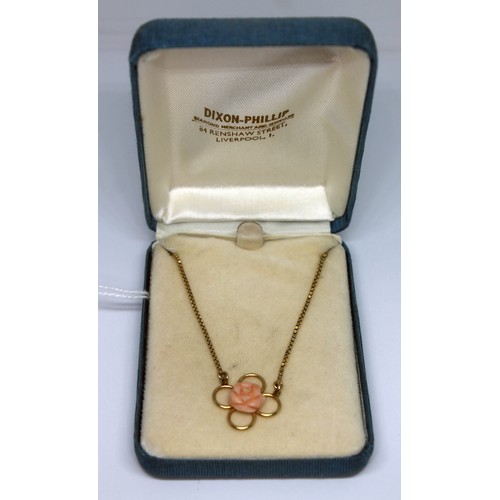 271 - A 9ct gold and carved coral pendant choker, marked '9k' with UK import marks, length 38cm, the carve... 