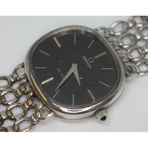 134 - A 1974 silver Omega De Ville dress watch 8390 having signed black dial, silver hour batons and dauph... 