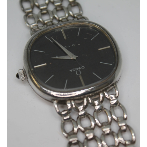 134 - A 1974 silver Omega De Ville dress watch 8390 having signed black dial, silver hour batons and dauph... 