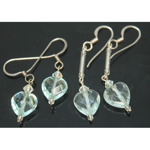 171 - Two pairs of aquamarine earings, each formed as a facetted heart shaped cut stone on drop, lengths 2... 