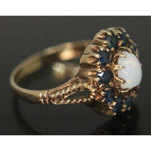 203 - A precious opal and sapphire ring, the setting measuring approx. 13mm x 12mm, hallmarked 9ct gold ba... 