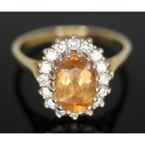 102 - A citrine and diamond cluster ring, the central stone measuring approx. 8mm x 5mm x 2mm, surrouned b... 