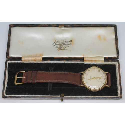 135 - A 1950s hallmarked 9ct gold Garrard wristwatch with champagne signed dial, alternate hour markers an... 