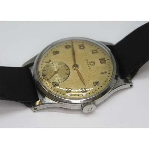 141 - A 1947 stainless steel Omega 13322, with signed tropical dial, Arabic numerals and hands in gold and... 