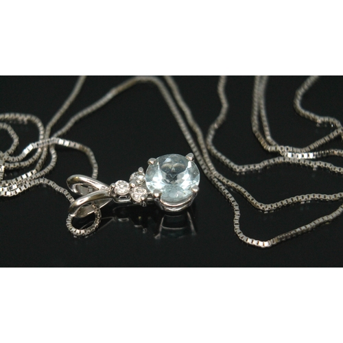 169 - An Italian diamond and aquamarine pendant, the round brilliant cut aquamarine diam. approx. 6mm and ... 