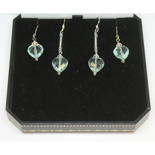 171 - Two pairs of aquamarine earings, each formed as a facetted heart shaped cut stone on drop, lengths 2... 