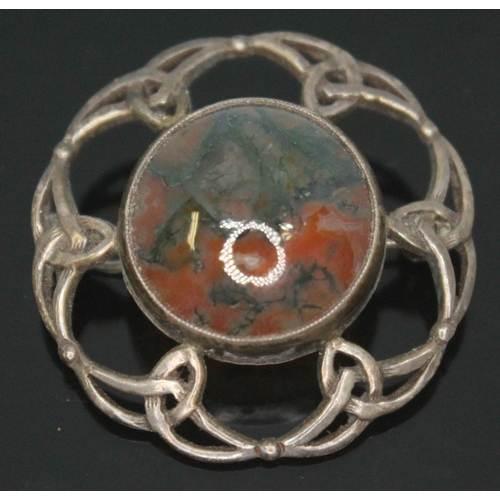 184 - A Scottish silver target brooch set with a central moss agate cabochon.